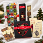 18 Marus + L’Artisan fyldte chokolader, 6 juletræer, 3 hjerter, 3 chokoladeplader og 3 × 100 g mandler